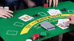 Live poker dealer at doyan303 login managing a hand of Texas Hold'em